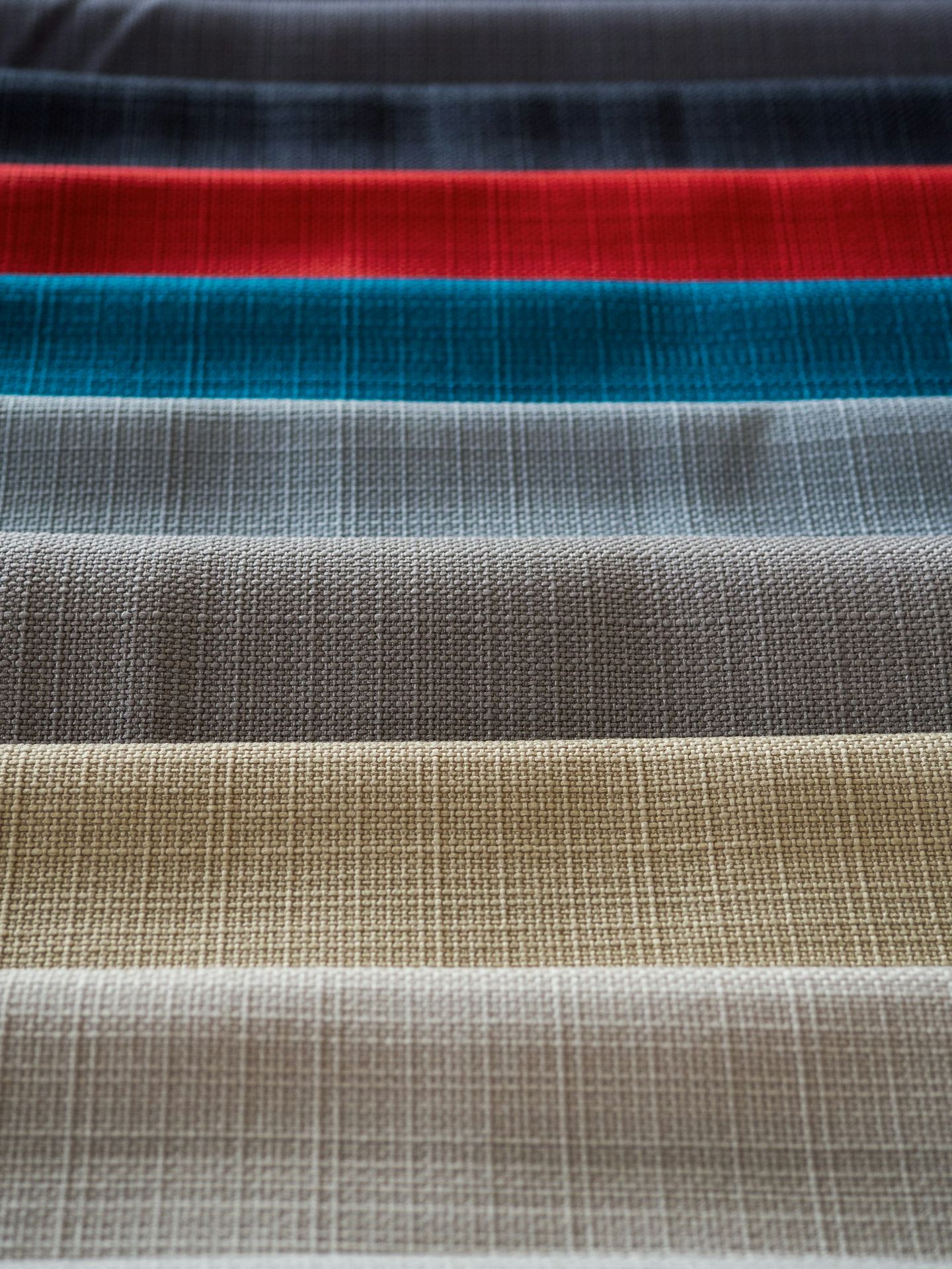 red white and black striped textile